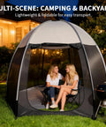 Two people sitting inside a Screen House Tent 10 By 10 Portable Canopy With Floor Mosquito Net Outdoor Room for Patio Backyard