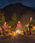 Super Cool Solar Torch Lights Outdoor Six Pack With Realistic Dancing Flickering Flames installed around campfire at night.