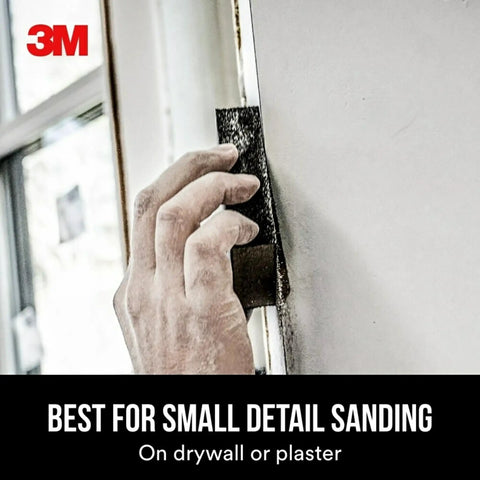 Hand using Drywall Sanding Sponge Set 2 Pack Dual Grit Block Fine And Medium Grits for removing and smoothing joint compound.