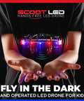 Person holding Hand Operated LED Scoot Drone With Motion Sensor For Kids And Adults Indoor Flying UFO Toy With Ultra Bright Red And Blue Lights
