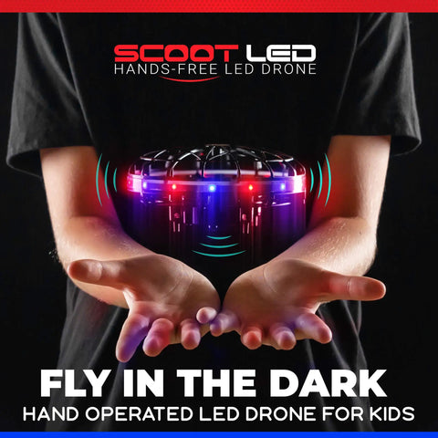 Person holding Hand Operated LED Scoot Drone With Motion Sensor For Kids And Adults Indoor Flying UFO Toy With Ultra Bright Red And Blue Lights