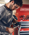 Man using 11 Piece SAE Ratcheting Wrench Set With 72 Tooth Box End For Quick Engagement And 15 Degree Offset In Tight Spaces