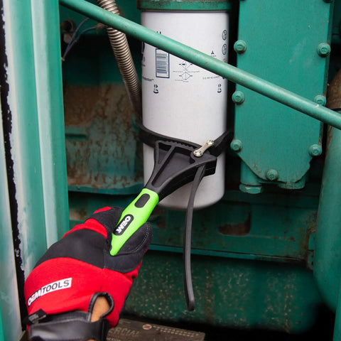 Using Two Piece Rubber Strap Wrench Set For Oil Filters, Pipes, Faucets, And Jar Openers to remove oil filter, close-up