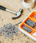 Top Shelf 50 Pack Stainless Steel Hex Nuts With Coarse Thread built tough with hammer and assorted screws in DIY workshop.
