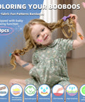 RAINLOS kids adhesive bandage set, 20 patterned bandages visible on a child in a floral dress