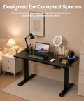 ExaDesk 35 By 20 Inch Electric Standing Desk Compact Height Adjustable Sit Stand Workstation in a small bedroom.