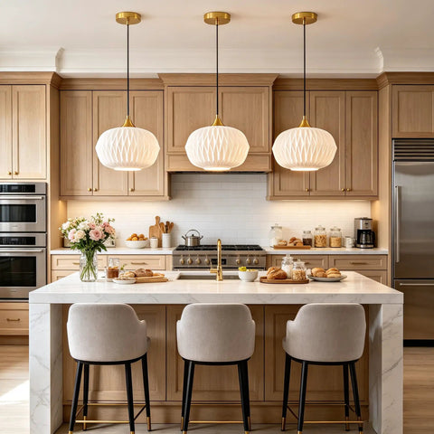 Vaziden Milk Glass Pendant Lights Kitchen Island Gold Chandelier 11.81" hanging above a marble kitchen island with seating.
