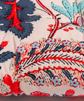 Close-up of outdoor indoor wicker patio seat cushion with blue and red leaves design, 17 x 17 inches, washable polyester pad