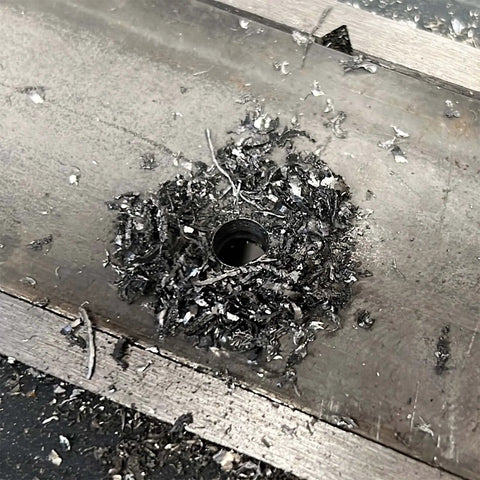 Hole drilled in metal surface using Beast Heavy Duty Cobalt Drill Bit Set 1/16 To 1/2 Inch, 17 Piece M35 High Speed Steel Twist Bits