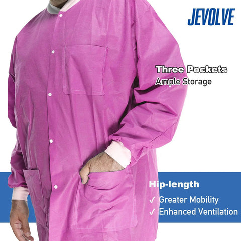 Close-up of pink 50 pack disposable lab coats for adults hip length with pockets and knit cuffs 45gsm SMS multi layer fabric