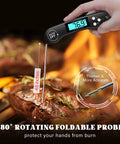 Pro Grade Instant Read Digital Meat Thermometer For Grilling And Cooking, 2-3 Second Temperature Check With 1 Degree Fahrenheit Accuracy, Perfect For Steak, BBQ, Smoking Brisket, Oven, And Slow Cooker. Hand holding black digital thermometer with 4.6-inch probe in steak