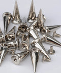 Twenty Pairs Of One Inch Silver Zinc Alloy Bullet Cone Spike Studs With Heavy Duty Iron Screws For Sick Punk Rock Leather And Kickass Streetwear Custom Accents Includes Quick Setup Tools, close-up of shiny silver cone spikes.