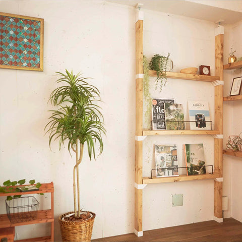 Floor To Ceiling 2 X 4 Mounting Brackets For Heavy Duty Vertical Storage And Diy Wall Shelves featuring wooden shelves with plants and decor.