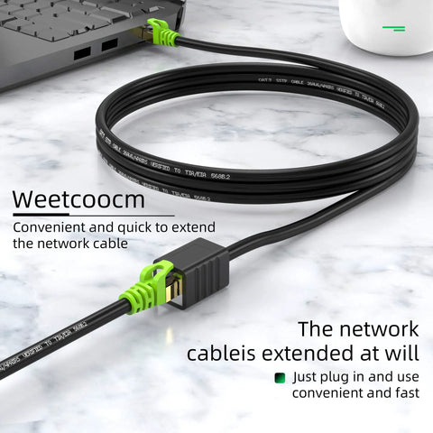 Cat6a Shielded Ethernet Extension Cable 20 Feet Upward Angled RJ45 Patch Cable connected to laptop on desk