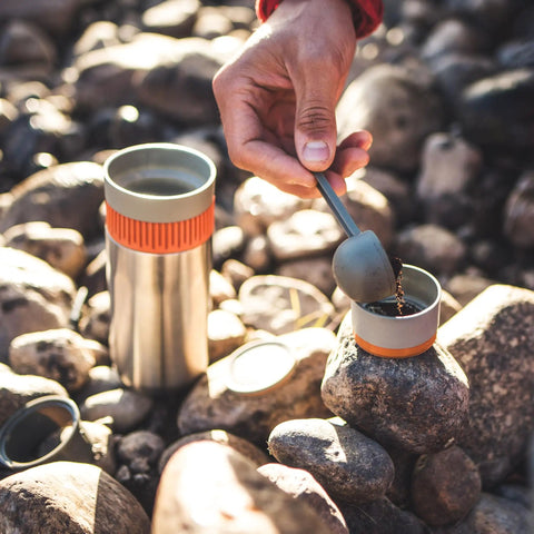 All In One Portable Coffee Maker With Vacuum Pressure Brew Hand Powered On The Go Coffee Brewer Insulated Stainless Steel Travel Mug 10 Ounce Thermo Cup Quick Fresh Brew For Commutes And Outdoors on rocks with hand pouring coffee