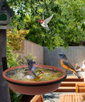 Built Tough Tree Mounted Bird Feeder With Brick Red Bath Tray 8.5 Inch Diameter 1.85 Inch Deep installed on a tree with birds.