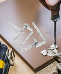 Stainless Steel Hidden Bookshelf Door Hinges With Auto Close Function being installed on door, showing concealed half waist design