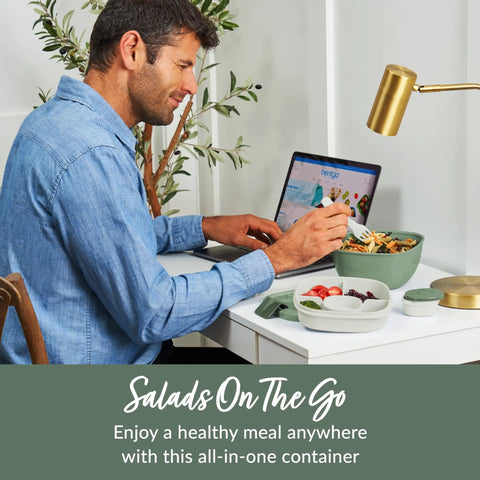 Man using Salad On The Go Meal Prep Kit With 54 Oz Bowl Four Compartment Toppings Tray Leak Proof Dressing Container Reusable Fork BPA Free Lunch Box Removable Bento Tray Khaki Green at desk.