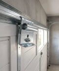 Close-up of 2 Piece Adjustable Garage Door Top Bracket Kit Made Of Galvanized Steel With Anti Oxidation Finish installed on a garage door.