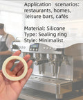 Hand holding 54mm Silicone Steam Ring For Espresso Grouphead Gasket Replacement Fits Breville And Sage Espresso Machines 870 878 880 860