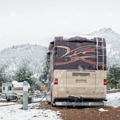 RV in snowy landscape using 12 Foot Heated Drinking Water Hose With Freeze Protection Down To Minus 40 Degrees Energy Saving Thermostat.