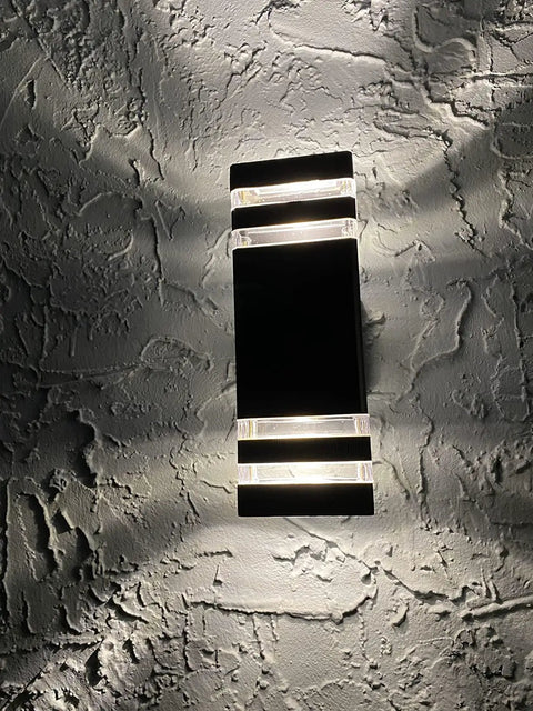 Up And Down LED Outdoor Wall Light Fixture In Aluminum IP65 Rated For Porch Patio And Garage Warm White 3000K on textured wall