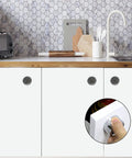 3 Piece Round Adhesive Towel Hooks In Chrome Finish on kitchen cabinets with detail of self-adhesive application close-up