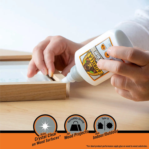 Applying Gorilla Clear Wood Glue For Fast Strong Bonds Pack Of Two 4 Ounce Bottles to a wooden frame for indoor project.