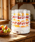 Heavy Duty Electric Food Dehydrator With Five Clear Trays And Adjustable Heat Zones For Zero Fuss Drying Of Fruit Meat Jerky And Custom Pet Treats Perfect For Family Dinners And Weekend Meal Prep with dried fruits on trays.