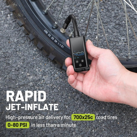 Ultra Compact Mini Bike Pump With Gauge 120 PSI Electric Bike Pump for Presta and Schrader Valves inflating bike tire.