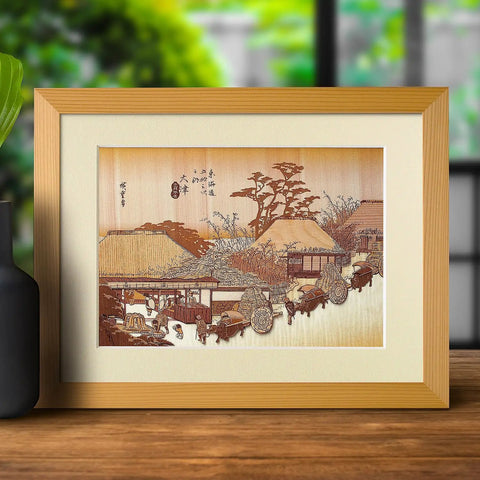 Framed Ukiyoe Art Kit Kiharie The Running Well Teahouse At Otsu By Hiroshige, Japanese inspiration, A4, on a wooden table