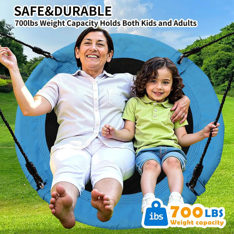 40 Inch Saucer Tree Swing For Kids And Adults, Heavy Duty 700 Lb Capacity Disc Swing with two people sitting on it in a park