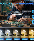 Person using 12X Magnifying Glass With Light And Stand For Crafting 5 Color Modes 9 Level Dimmable 144 LED Desk Lamp Hands Free Magnifier