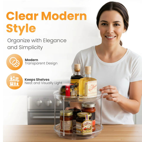 Front view of a clear two-tier lazy Susan organizer on a kitchen counter with spice jars.