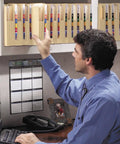 Man working with Legit Solid Manila End Tab Folders With Reinforced Straight Tabs And One Point Seven Five Inch Expansion Holds Up To Two Hundred Sheets Letter Size 25 Pack.