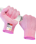 Cut Resistant Kitchen Gloves Level 5 Food Grade Protection For Safe Food Prep Small Pink HPPE Gloves holding a knife