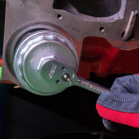 Mechanic using 64.5 mm 14 Flute Oil Filter Wrench Cap Tool Fits 2.0 To 5.7L Engines on car engine oil filter cap