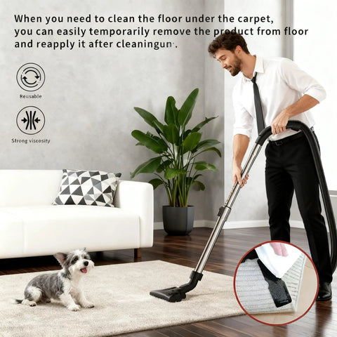 Man vacuuming carpet with Non Slip Rug Grippers Set, Reusable Double Sided Carpet Tape Pads, dog observing, room view.