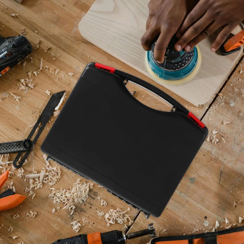 Badass Plastic Toolbox With Ergonomic Handle Designed For Mechanics And Handymen Who Demand Durability on a workbench.