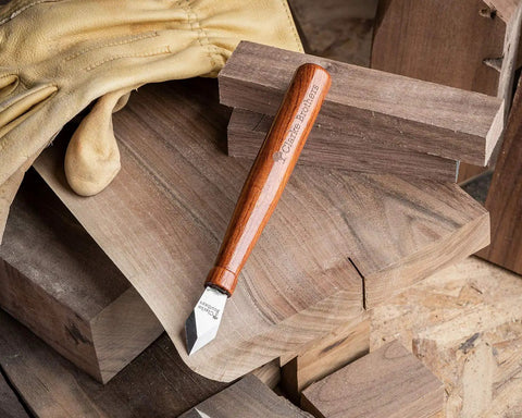 Premium Woodworking Marking Knife With Razor Sharp High Carbon Steel Blade And Durable Wooden Handle on wood pieces.