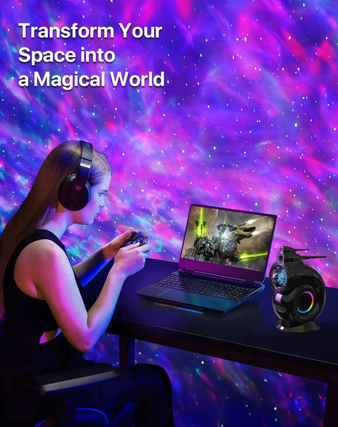 Galaxy Star Projector Night Light For Bedroom with pink and blue sky projection, timer, and Bluetooth speaker on desk.