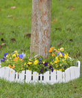 No-Dig Landscape Edging Kit With Anchoring Spikes, 4.5 Inch Tall White Wood-Look Garden Border around tree with flowers