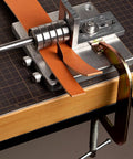 Manual Leather Strap Cutter For 60mm Width, Belt Cutting Machine With G-Clamps, 10 Sharp Blades in use on workbench