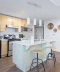 Modern kitchen with Bayman 3 Light Pendant Light With Dimmable LED Ceiling Fixture for kitchen island, chrome glass and adjustable height.