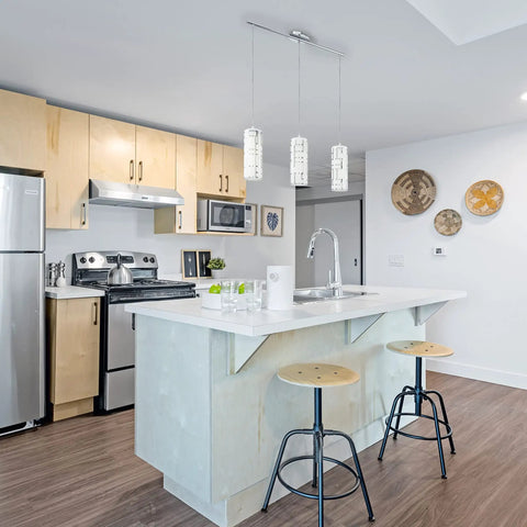 Modern kitchen with Bayman 3 Light Pendant Light With Dimmable LED Ceiling Fixture for kitchen island, chrome glass and adjustable height.