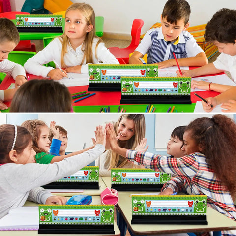 Children using 24 Pack Desk Name Plate Holders With Self-Adhesive Removable Grip And Built-In Pen Holder, Black Plastic Name Tag Displays For Classroom, School, Or Home Study, Easy Peel And Stick, 1.5 X 12 X 1 Inches at desks.