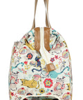 Side view of a patterned 22 inch duffel bag with 2 rolling wheels for women, lightweight weekender carry on suitcase with ergonomic handles.