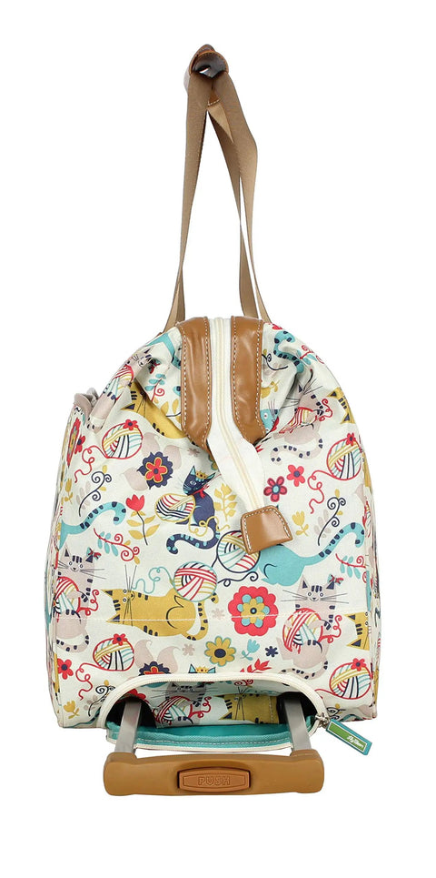 Side view of a patterned 22 inch duffel bag with 2 rolling wheels for women, lightweight weekender carry on suitcase with ergonomic handles.