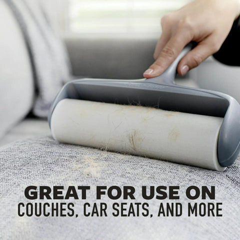 Close-up of Heavy Duty Lint Roller For Pet Hair And Debris Fifty Percent Stickier Extra Large Roll used on couch fabric.