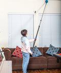 Person using a Six Foot Telescoping Extension Pole With Aluminum Shaft And EVA Grip Flip Lock Adjustable Sections for ceiling cleaning